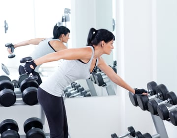 Woman exercising gym -- Commercial Mirrors